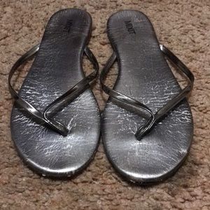 Silver shiny flip flops
